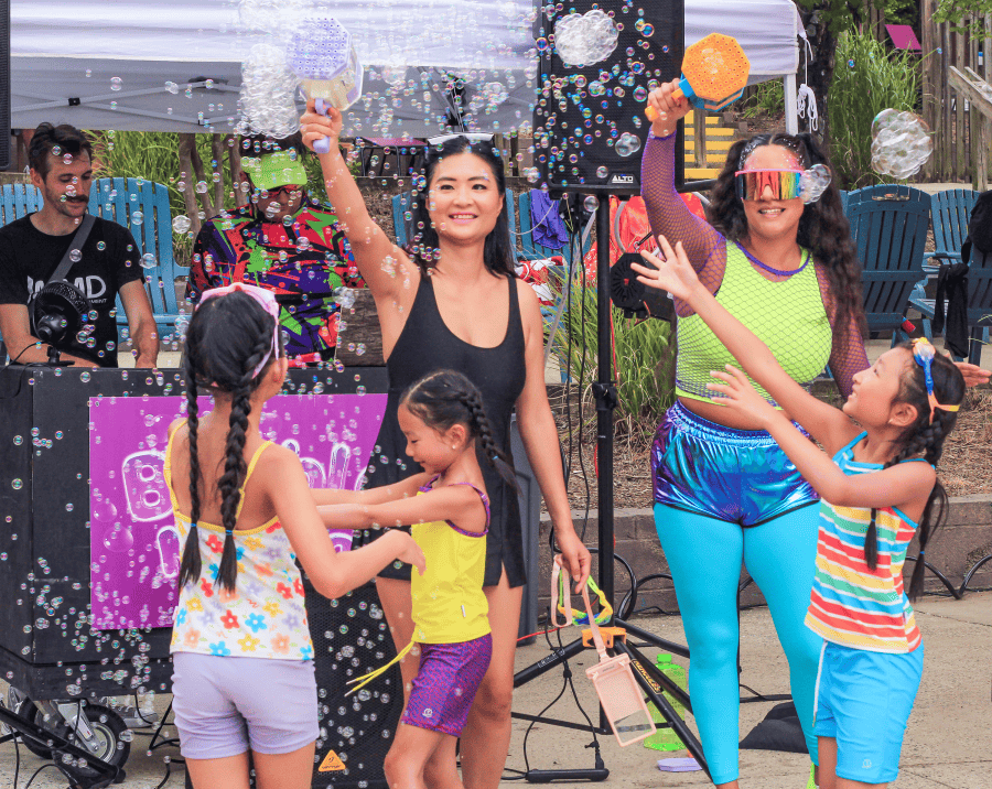 Kids and adults play with bubbles at Wet N Wild